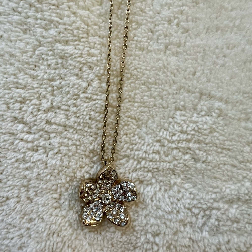 Necklace. Gold adjustable chain. Diamond and gold flower charm. Lilly Pulitzer.